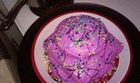 Strawberry cake with purple funfetti frosting